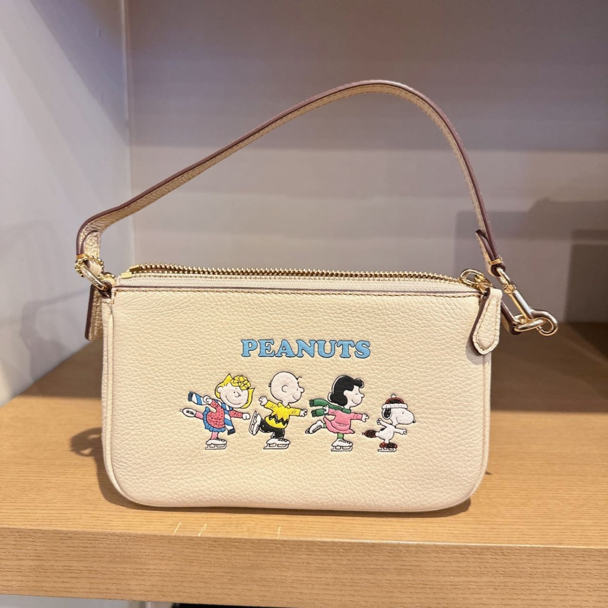 Coach CE858 Coach X Peanuts Nolita 19 With Snoopy And Friends Motif In Gold/Ivory Multi Coach CE858 Coach X Peanuts Nolita 19 With Snoopy And Friends Motif In Gold/Ivory Multi